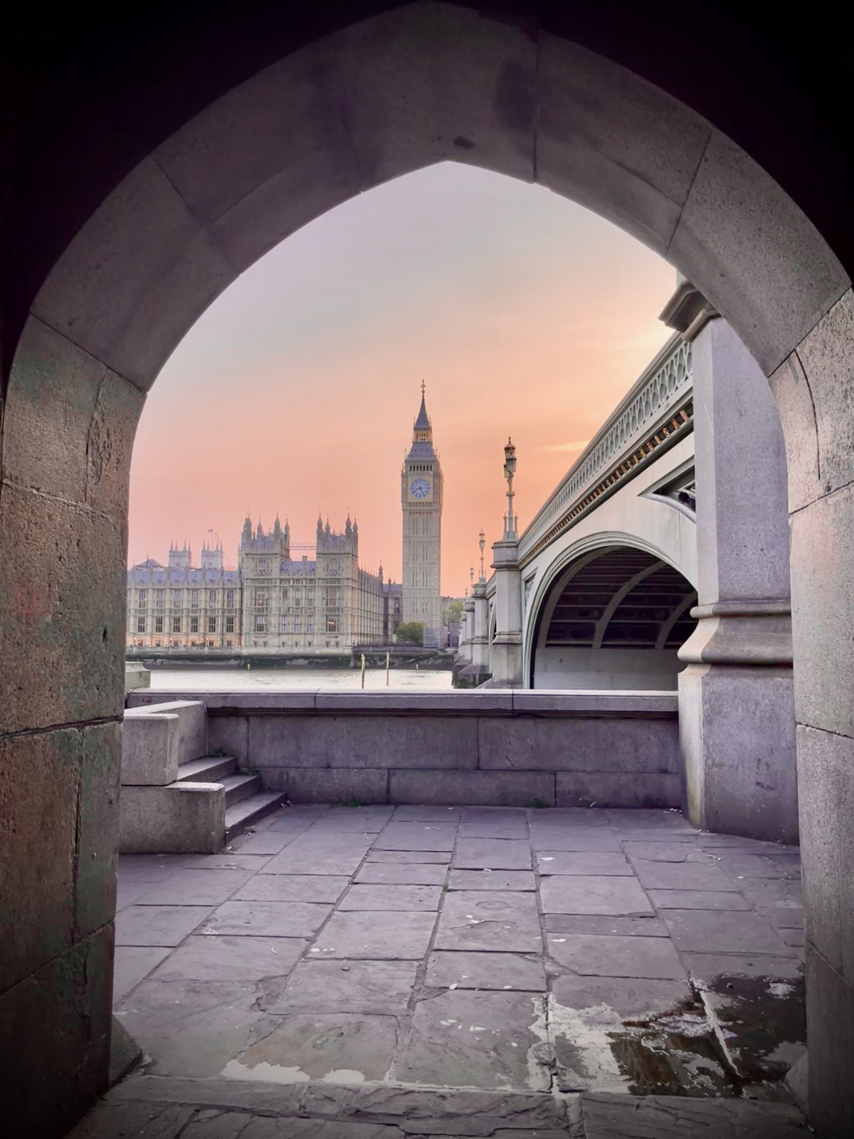 Big Ben and West Minster on the River Thames at sunset.